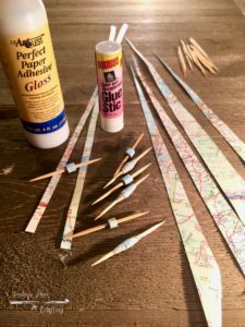 Paper, glue, and toothpicks for making paper beads