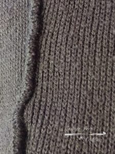 Serged seams on a sweater. Do not try to unravel.