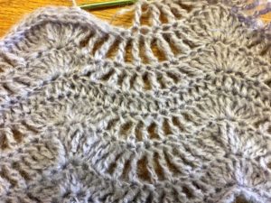 Wave pattern repeats in lacy waves crochet scarf