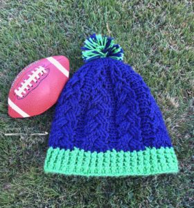 Cabled crochet hat. Seahawks colors.