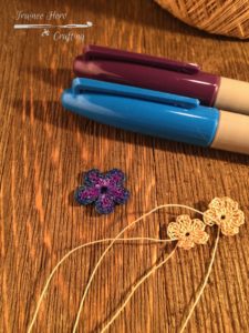 Purple and blue colored crochet flower