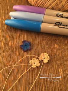 Blue and lavender colored crochet flowers