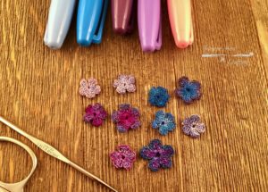 Crochet flowers colored with Sharpie pens in a Creative Life