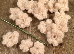 Crocheted puff stitch flowers for embellishing the lacy trellis scarf