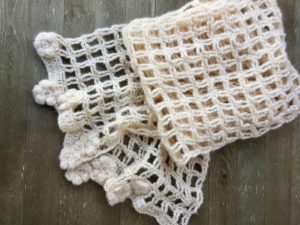 Lacy trellis scarf embellished with puff stitch flowers. Yay Crochet!