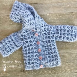 Crocheted waffle stitch baby cardigan sweater