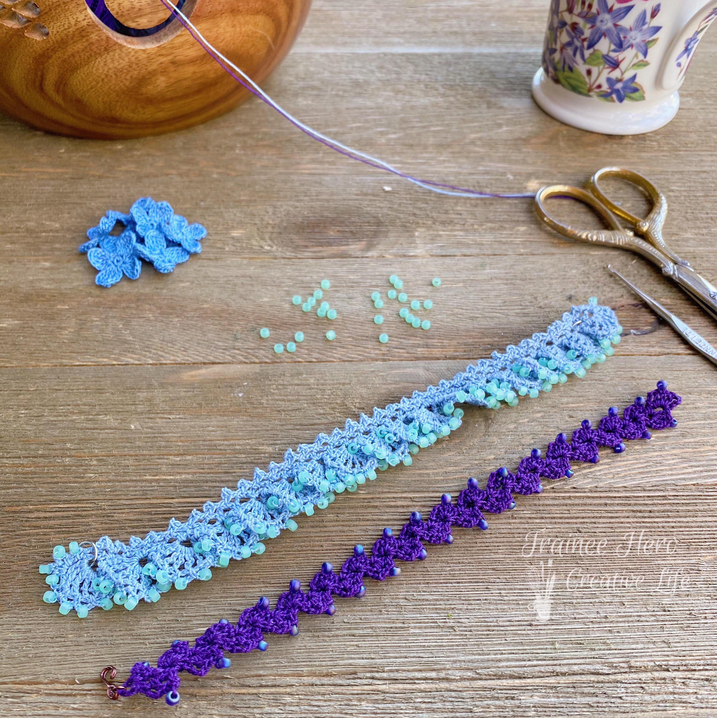 Two crocheted bracelets with beads laid out flat.