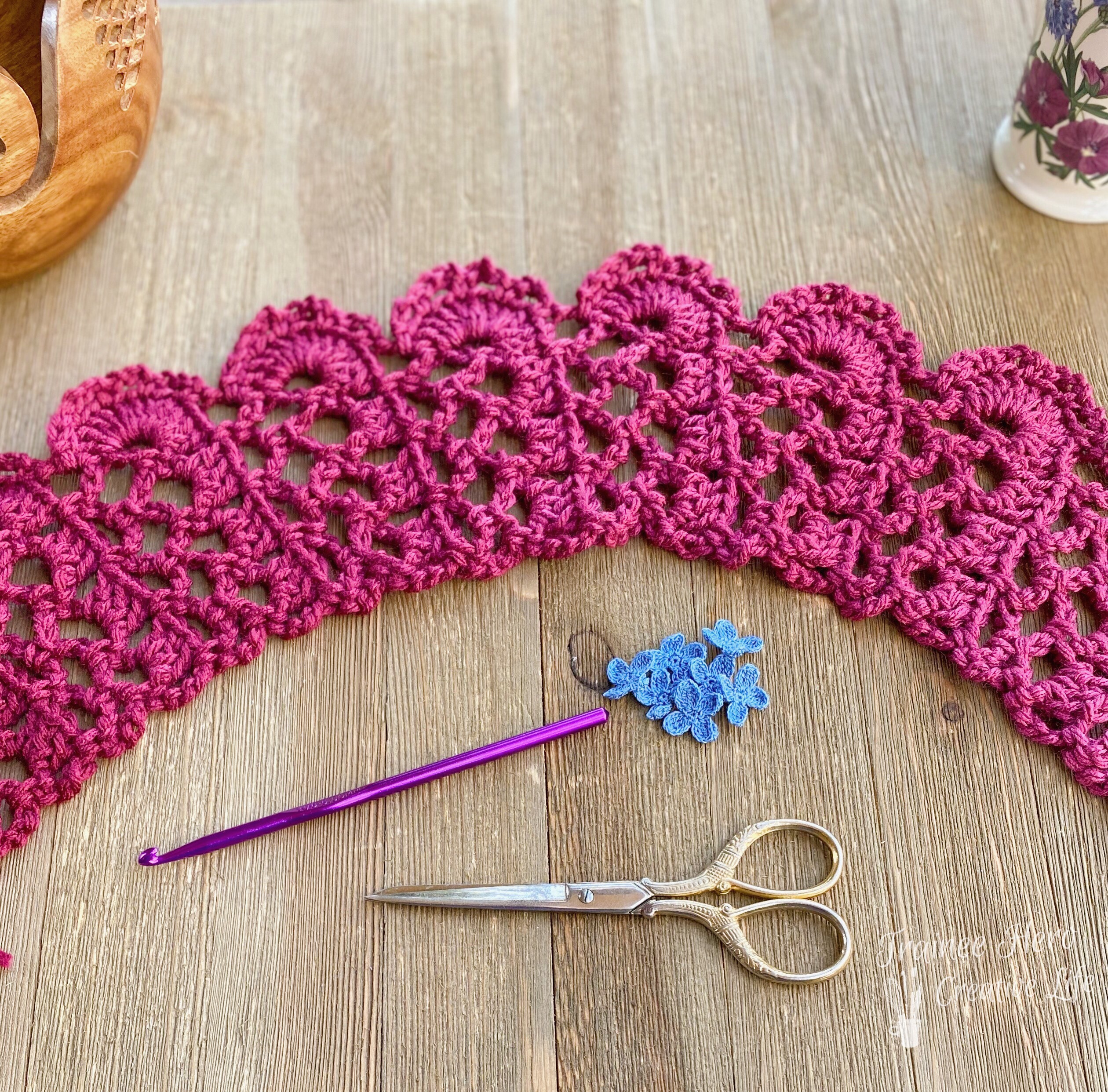Plumeria Scarf, a crochet edging pattern scarf, showing asymmetry of pattern.