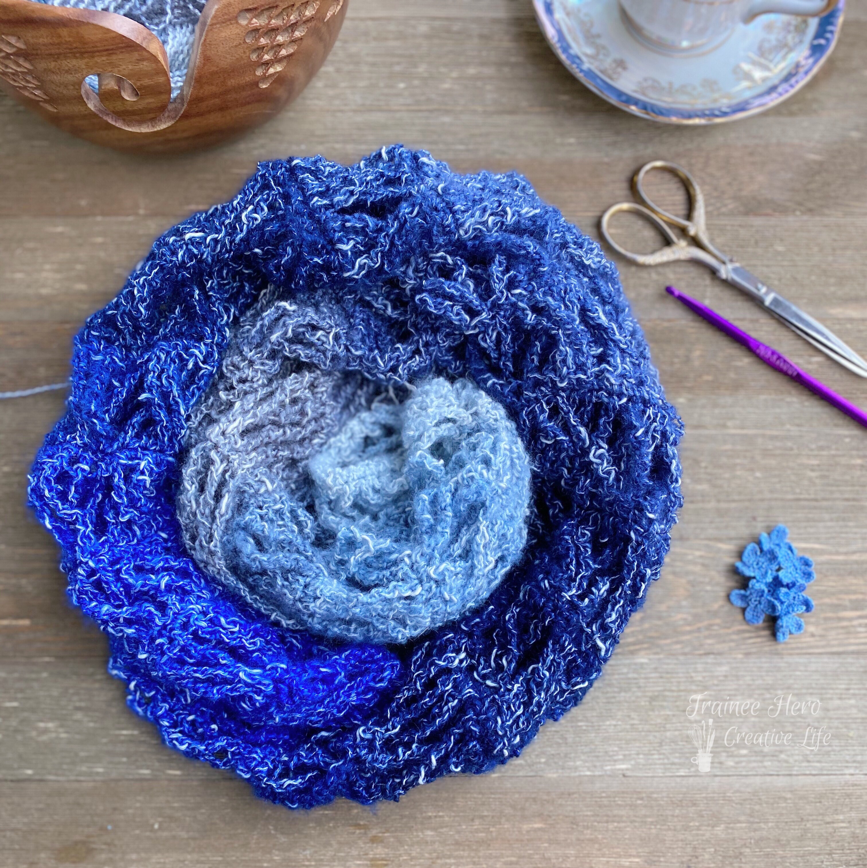 Crochet scarf rolled into a circle.
