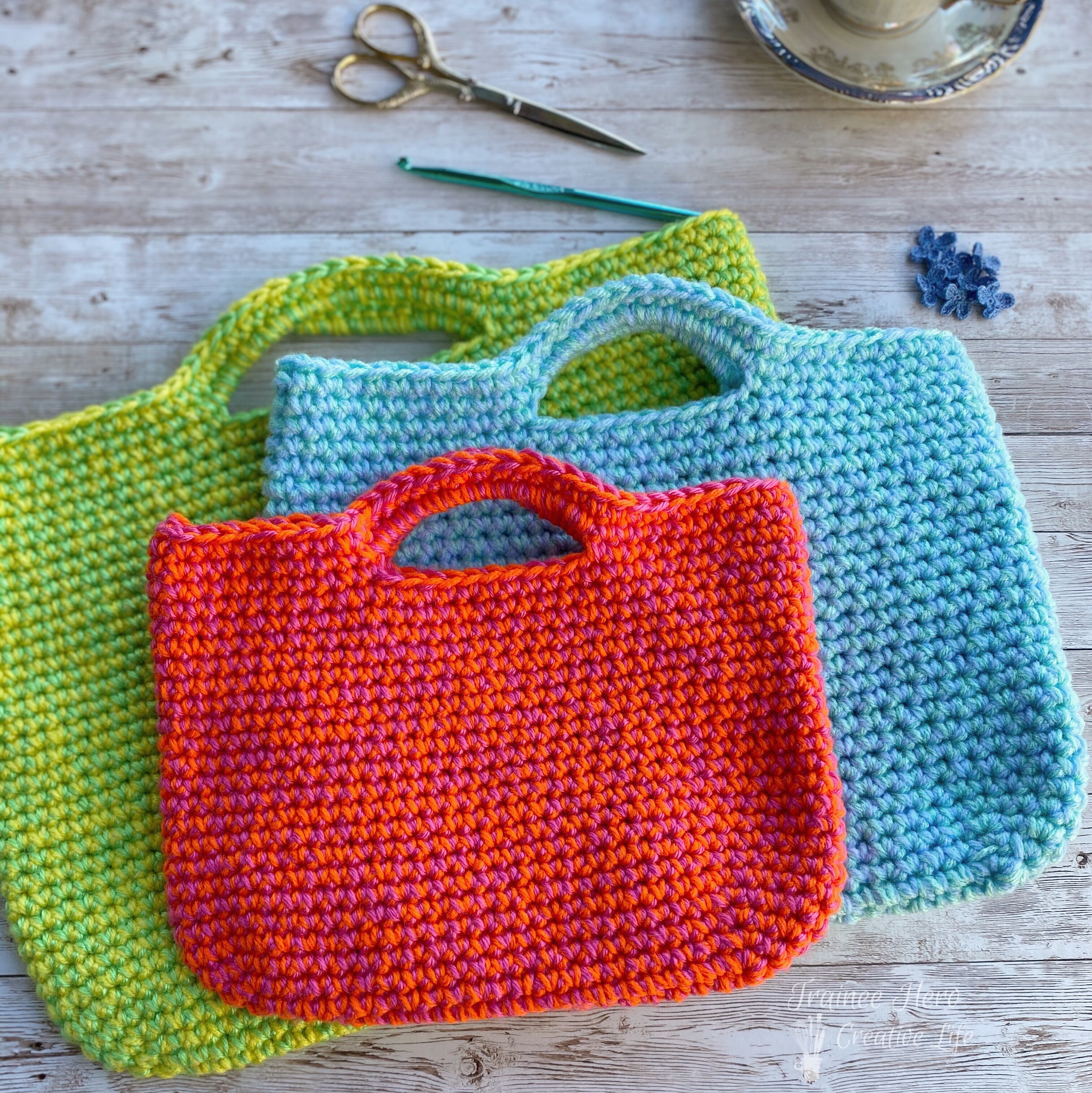 Three crochet project bags.